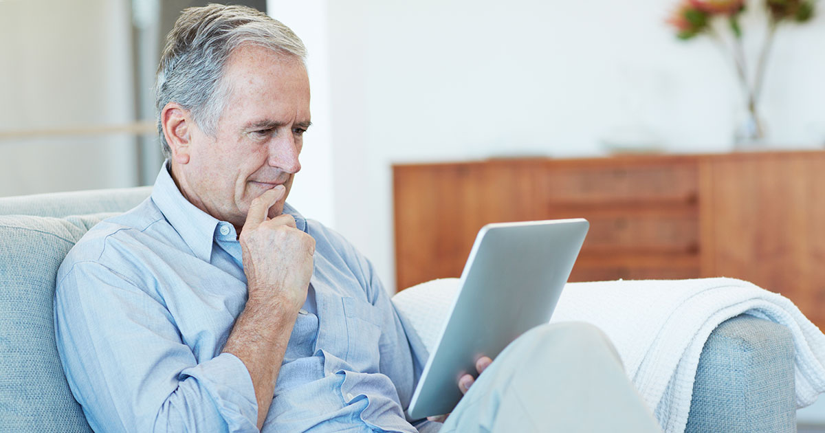 Man looking at his tablet